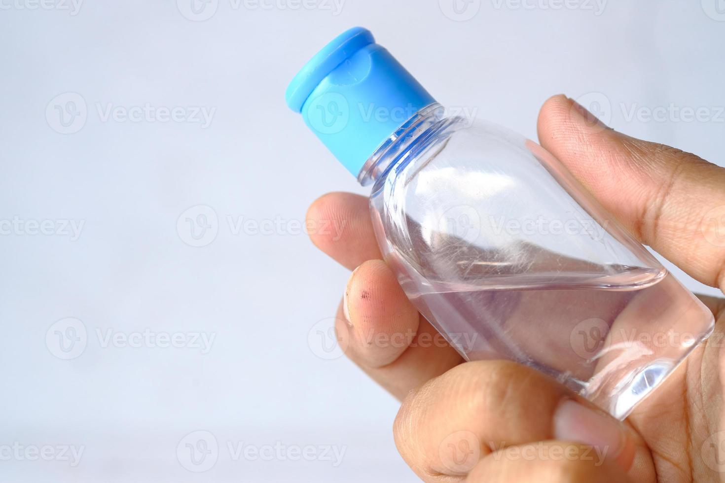 Hand holding sanitizer gel with copy space photo