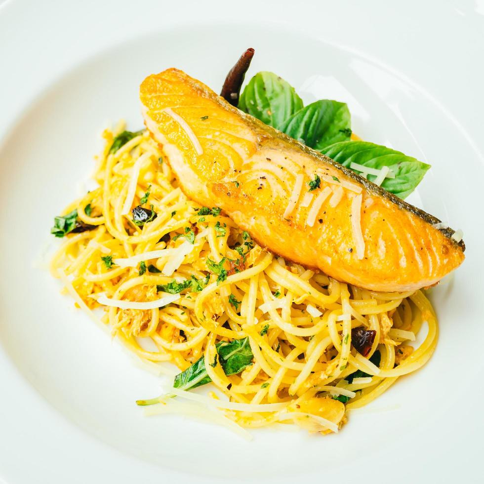 Spaghetti and Pasta with salmon fillet meat photo