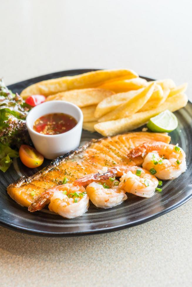 Grilled salmon and prawn steak photo