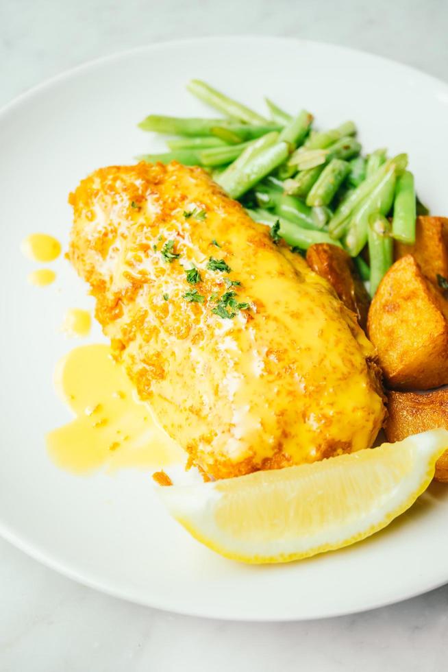 Fried chicken steak with lemon and vegetable photo