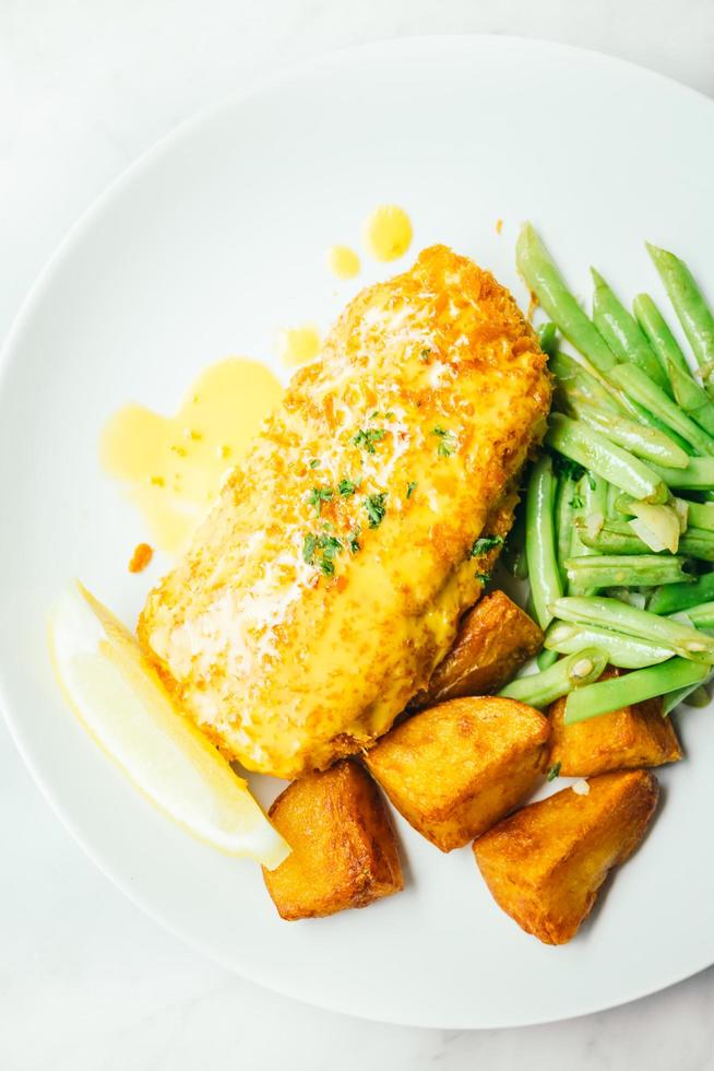 Fried chicken steak with lemon and vegetable photo