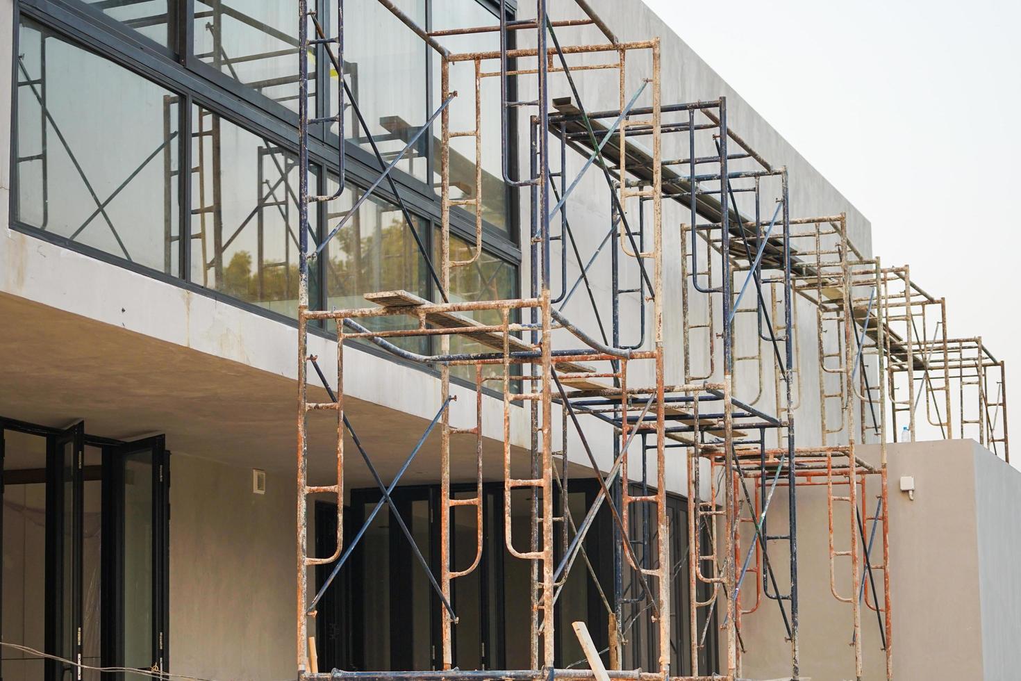 Closeup crowd of steel scaffolding set up at construction site photo