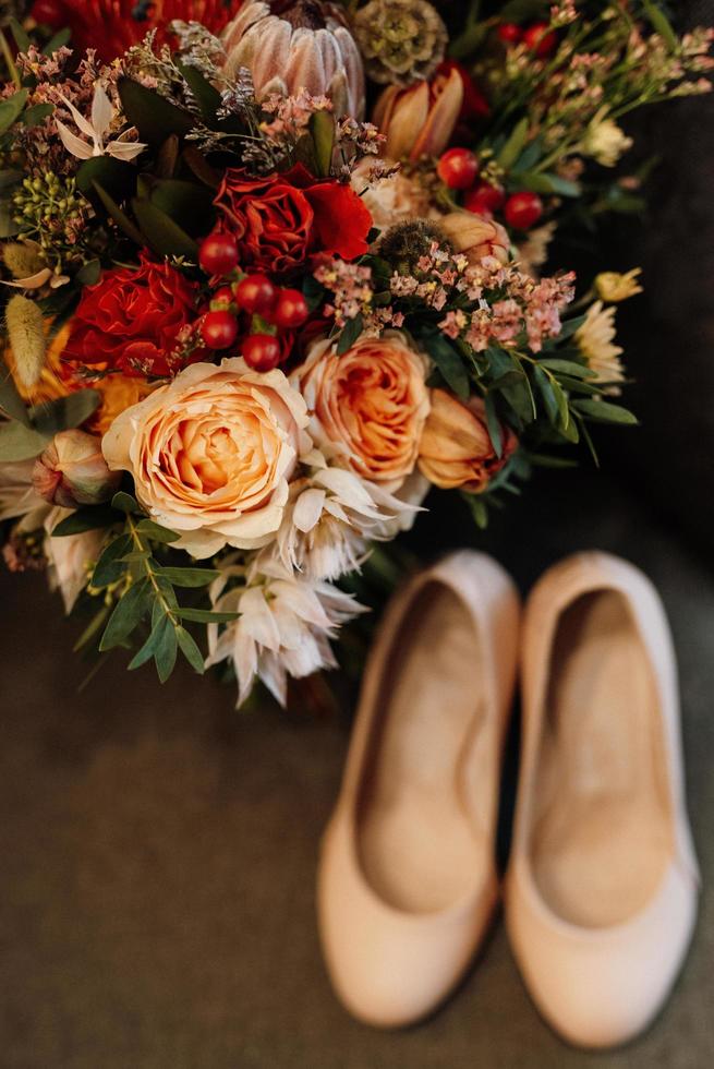 Bridal bouquet in red autumn shades dried flowers photo