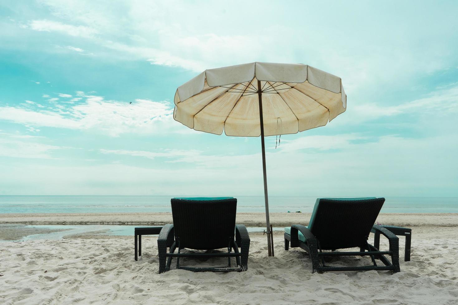 Closeup pair of beach bench on the beach photo