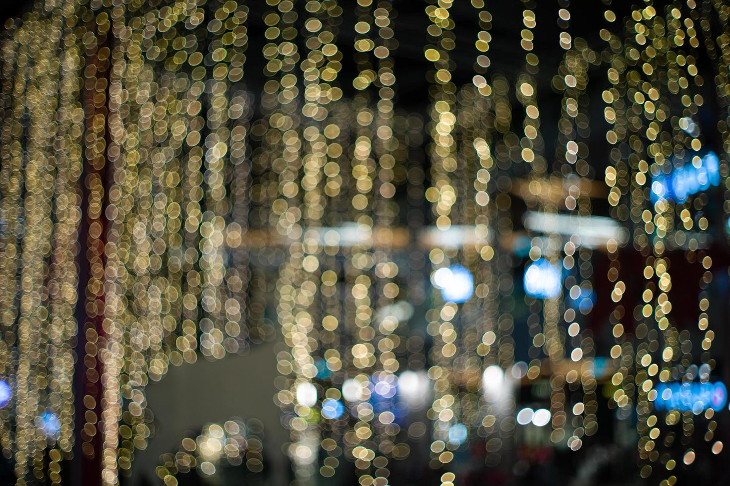 Abstract background and texture of golden bokeh lights for decoration in the outdoor event photo