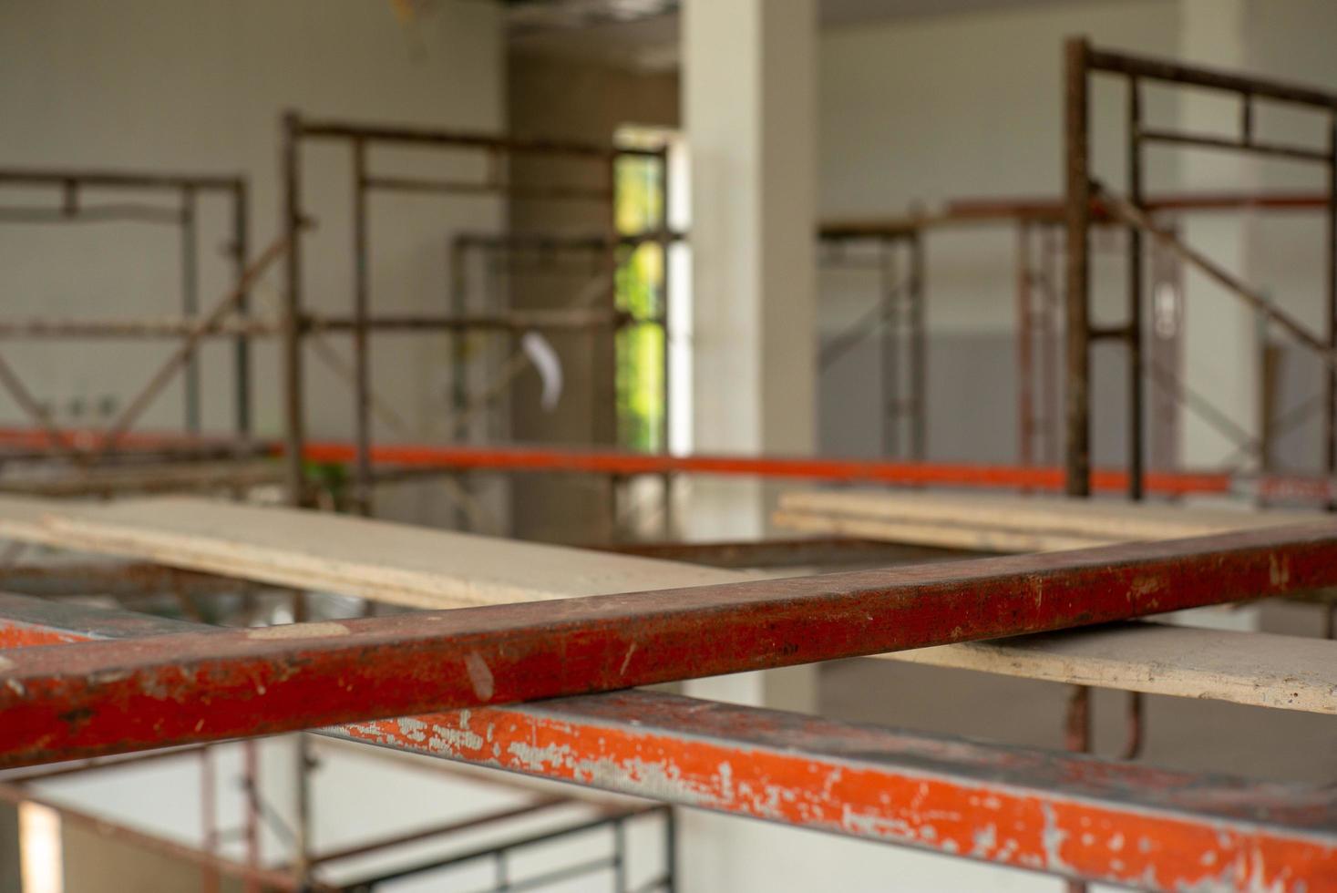 Closeup steel bars on the scaffolding for working at high level at the construction site photo