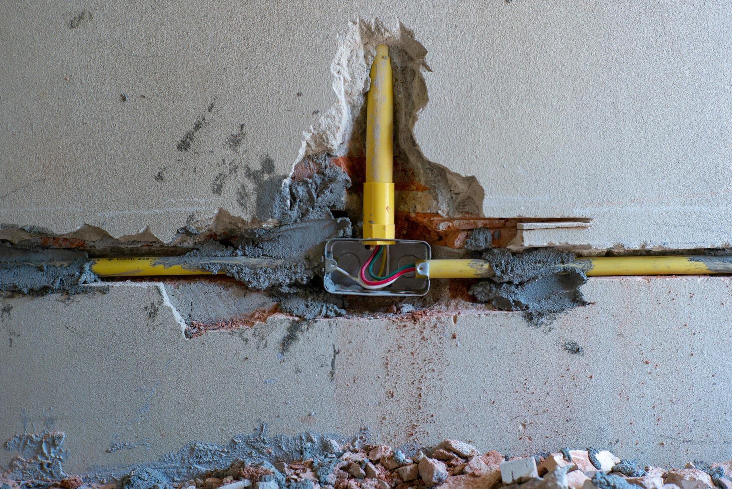 Closeup texture and background of broken plastered cement wall photo