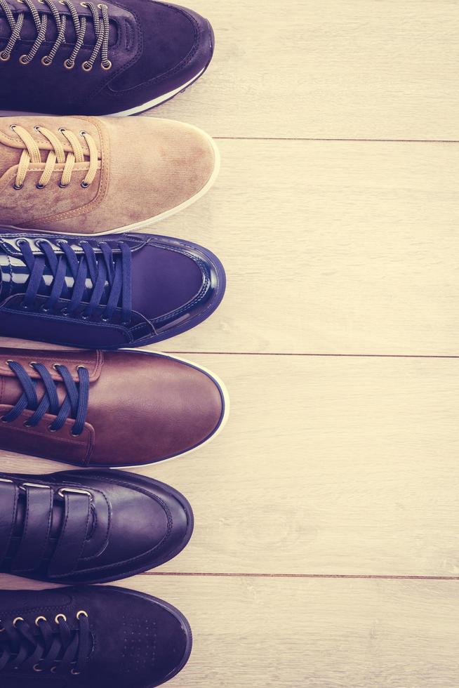 Leather shoes on wooden background photo