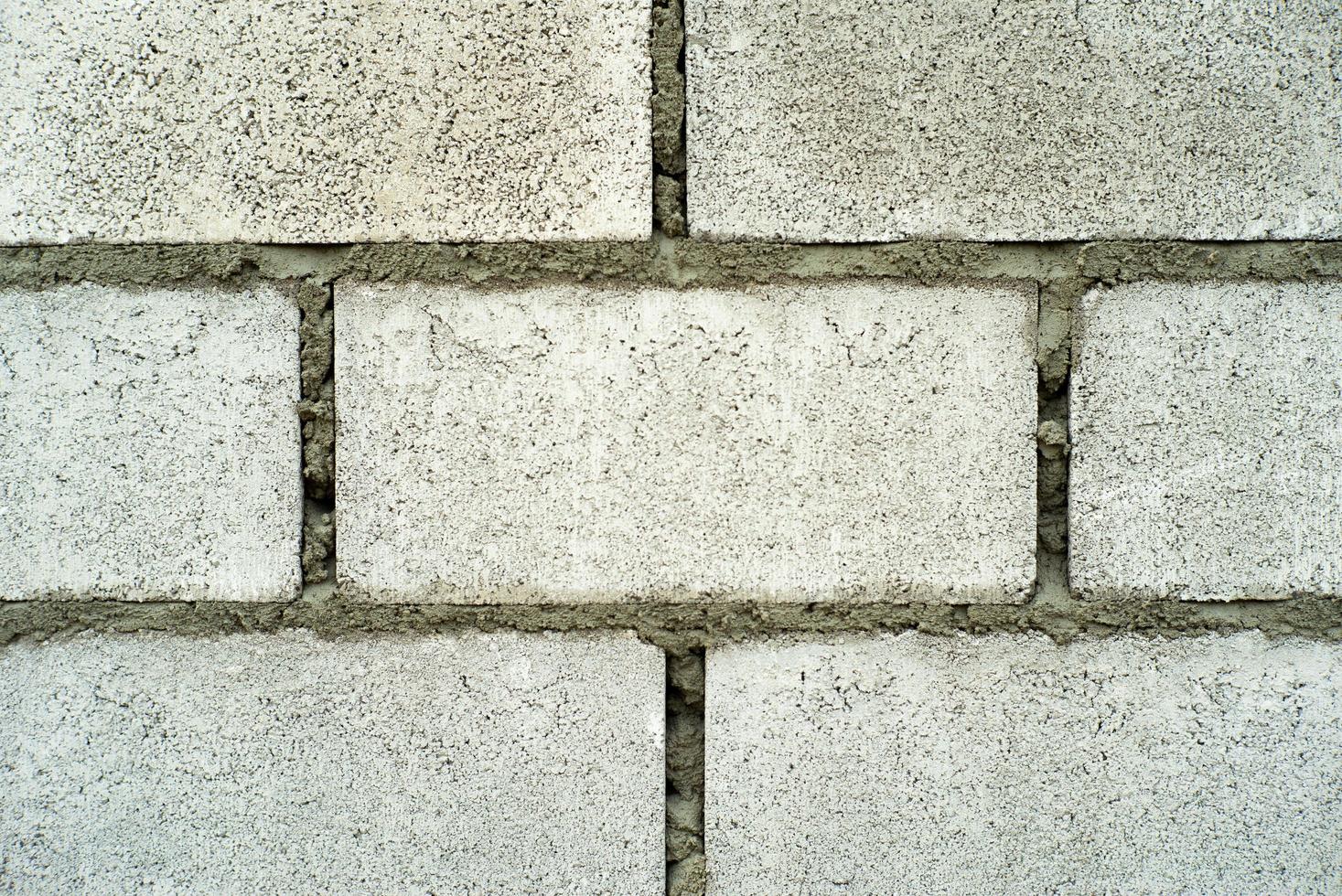 Textura abstracta y fondo de muro de albañil de hormigón en el sitio de construcción foto