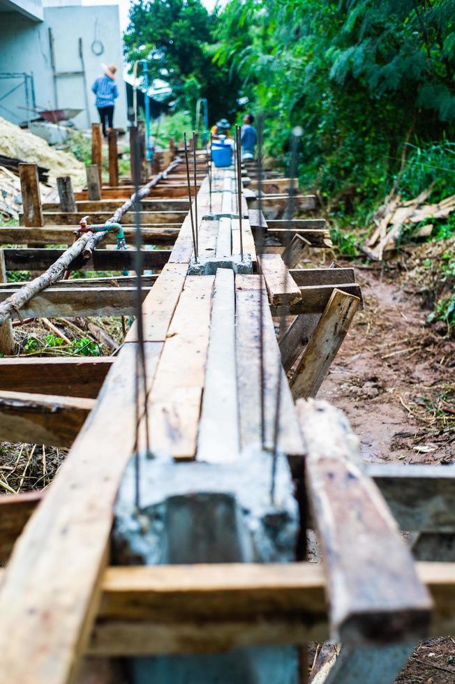 Reinforcement steel in the concrete posts for making the fence photo