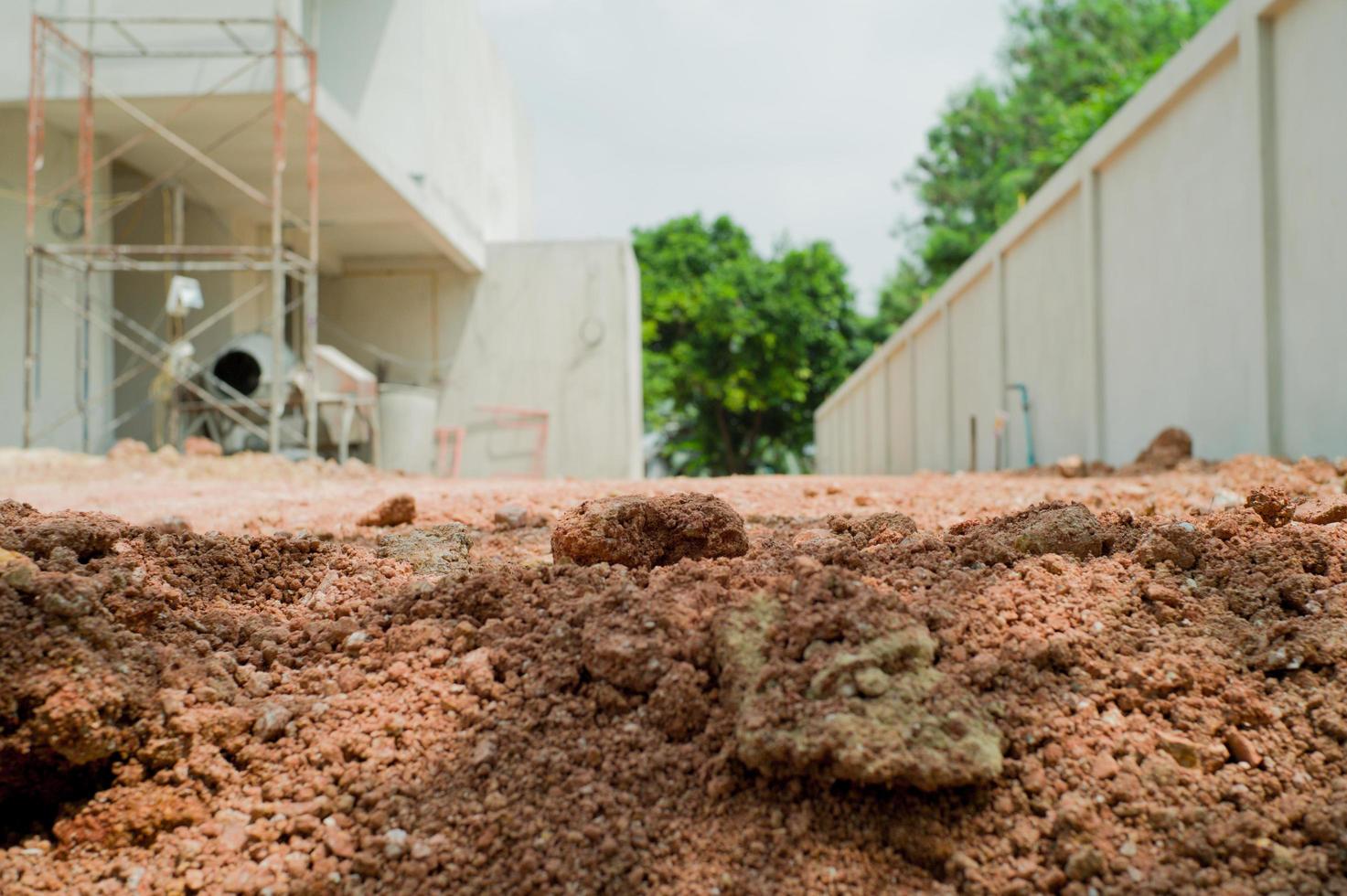 Fondo abstracto y textura del suelo en el suelo del sitio de construcción foto