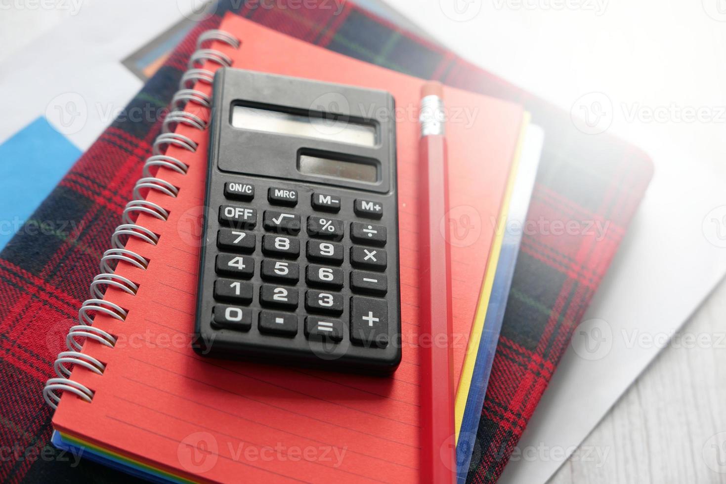 Close up of calculator and notepad photo