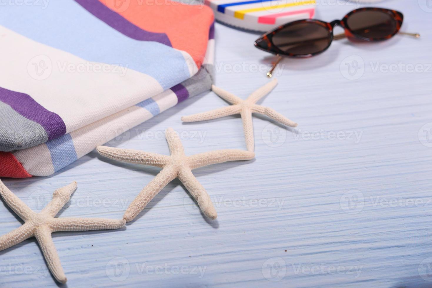 Summer beach accessories on table photo