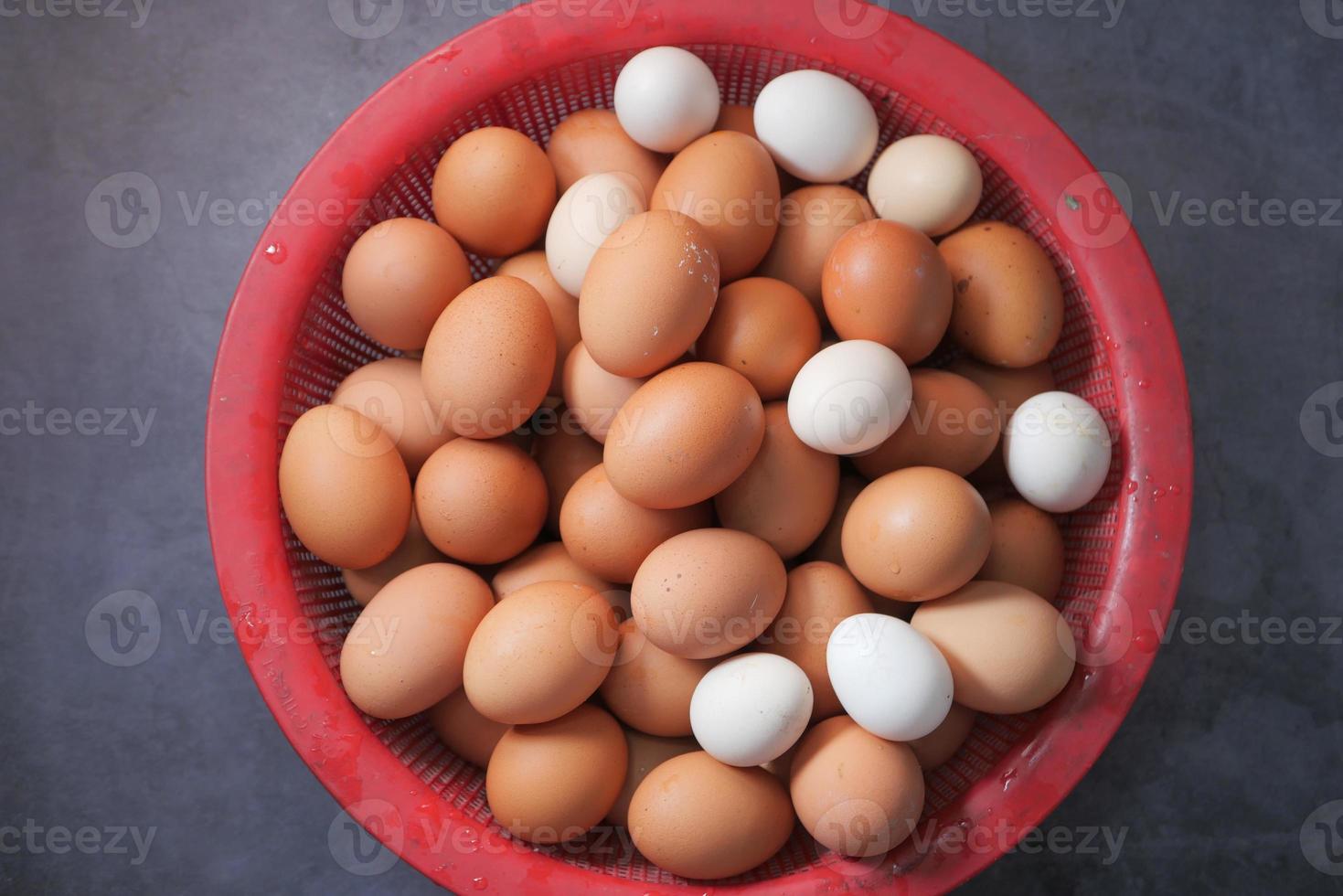 Top view of eggs in a bowl on table photo