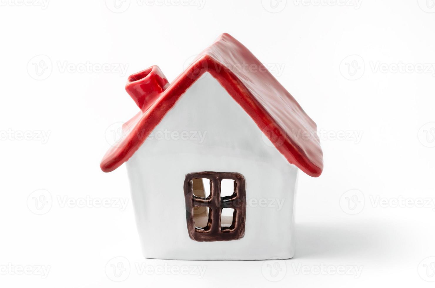 Small white porcelain house with a red roof photo