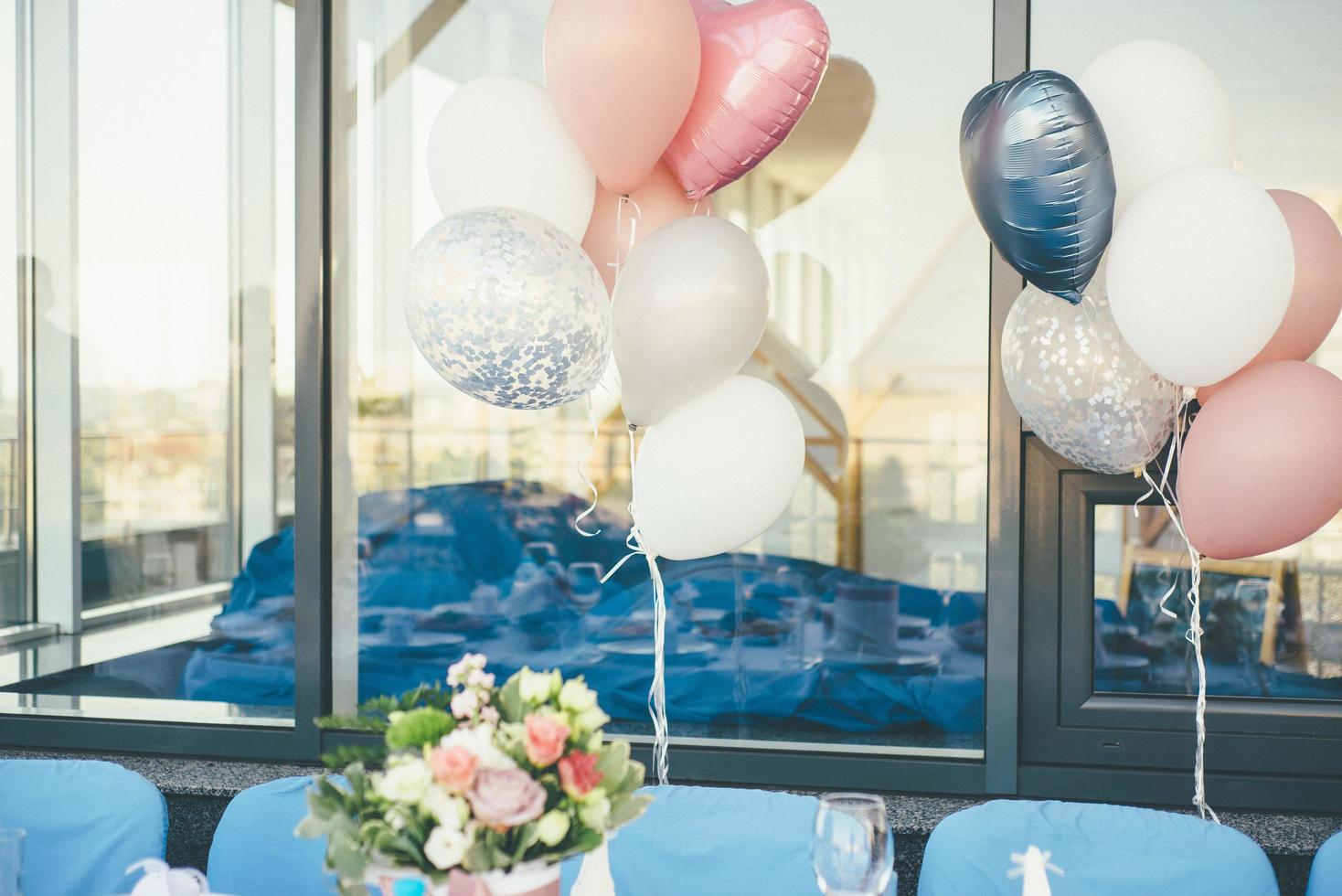 Balloons and flowers outside photo