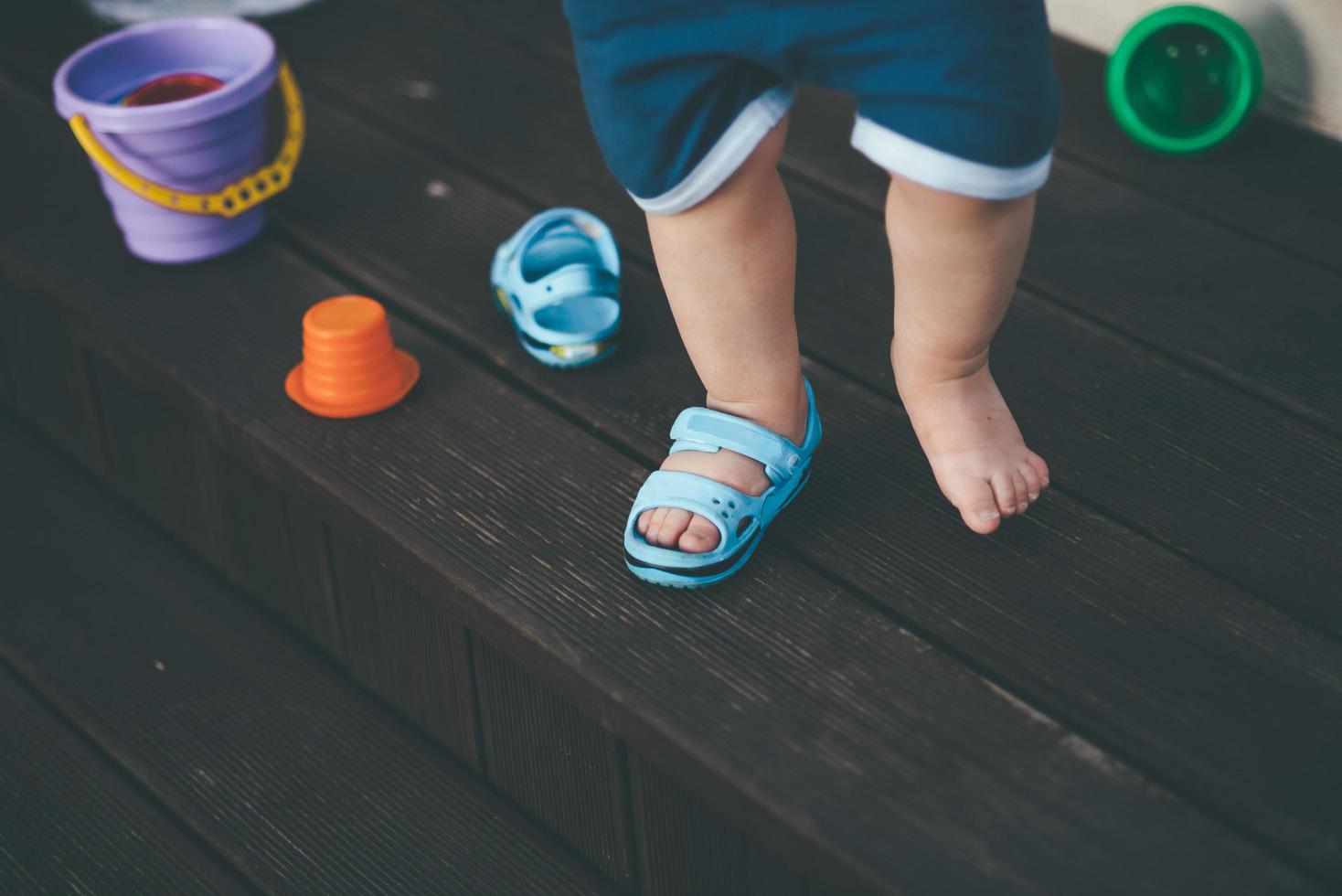 Child with one shoe photo