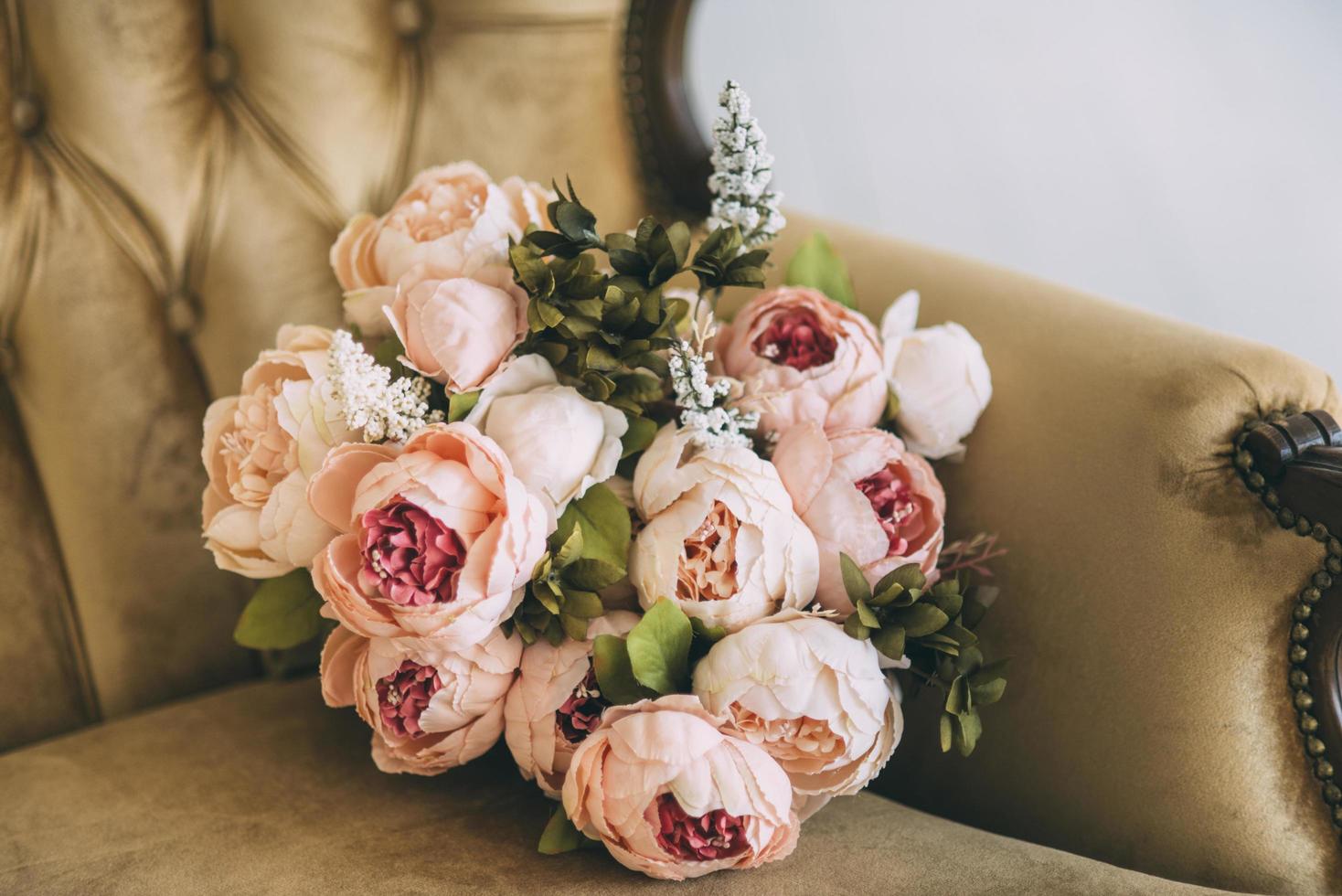 Peony bouquet in a chair photo