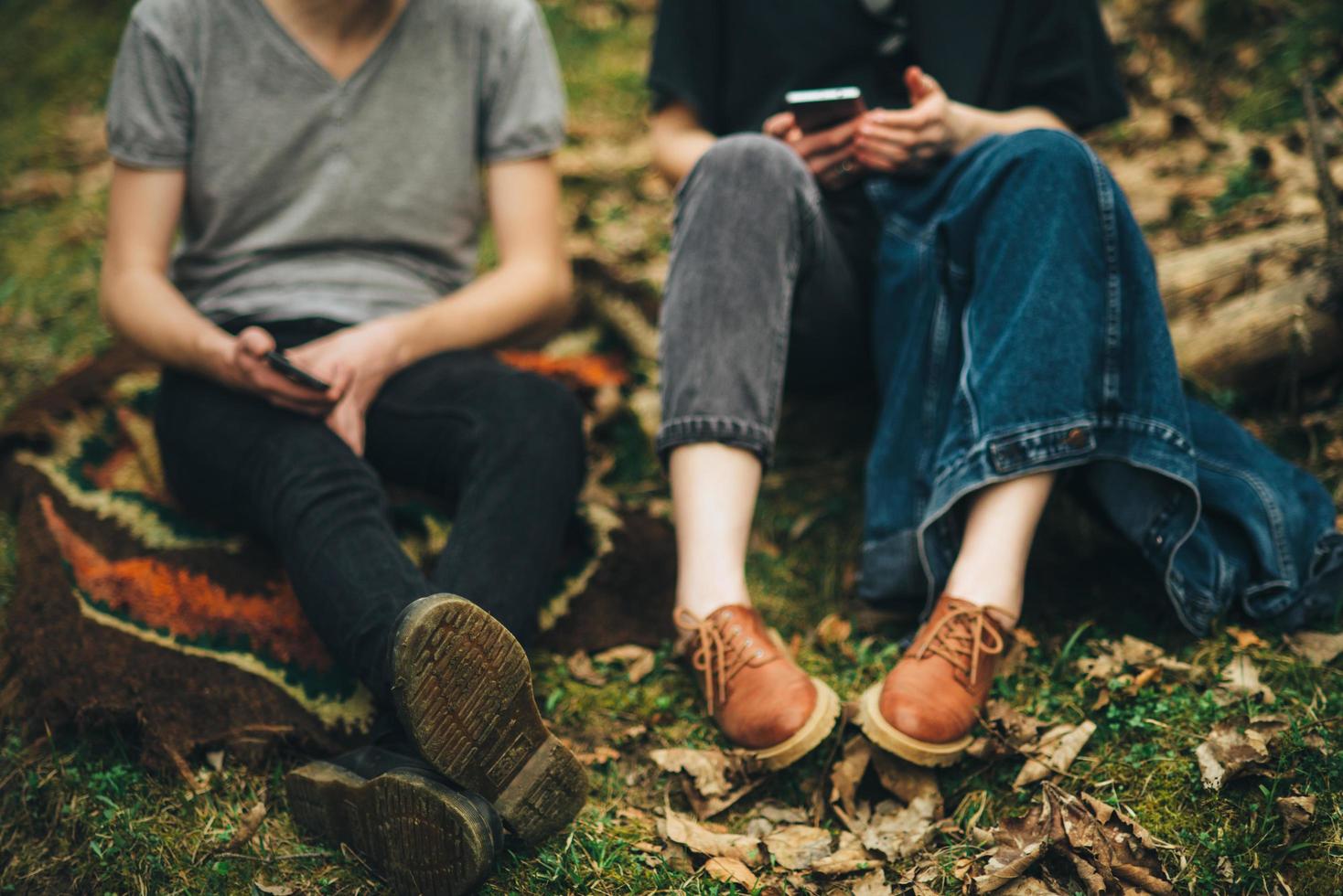 Couple sitting on leaves photo