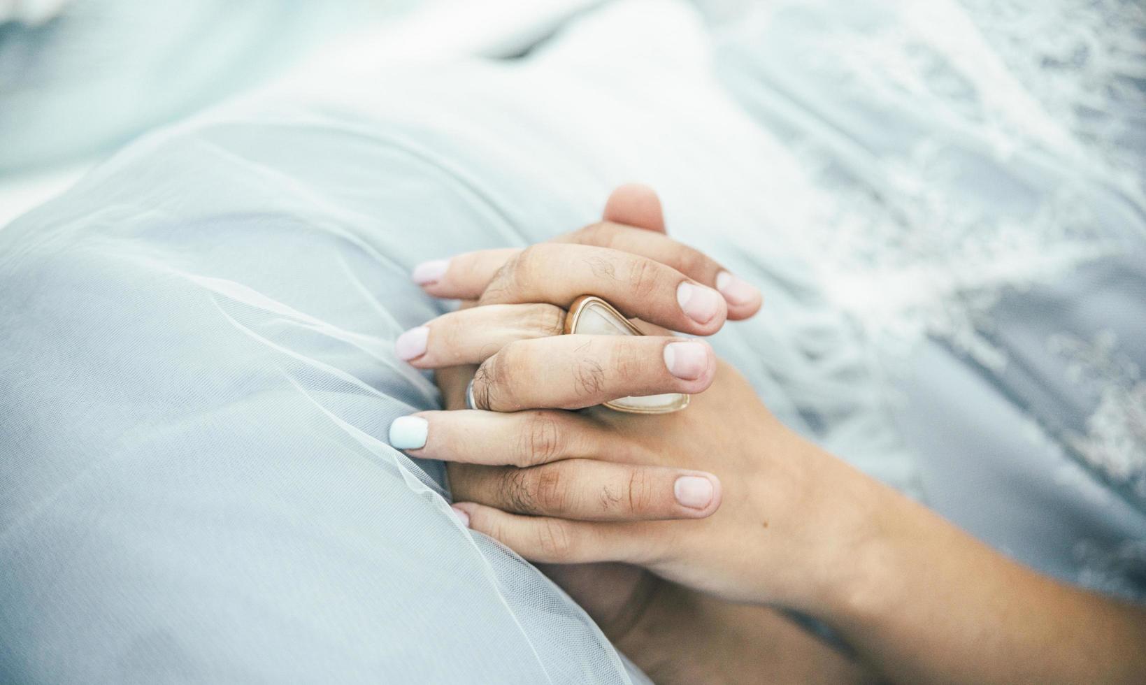 Couple holding hands photo