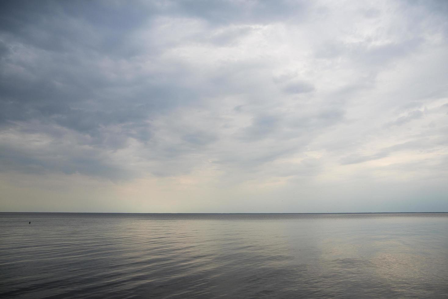 Calm sea with clouds photo