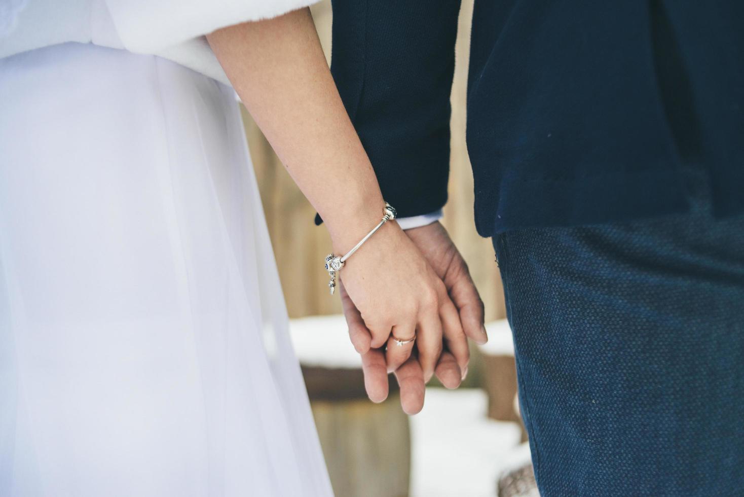 Married couple holding hands photo