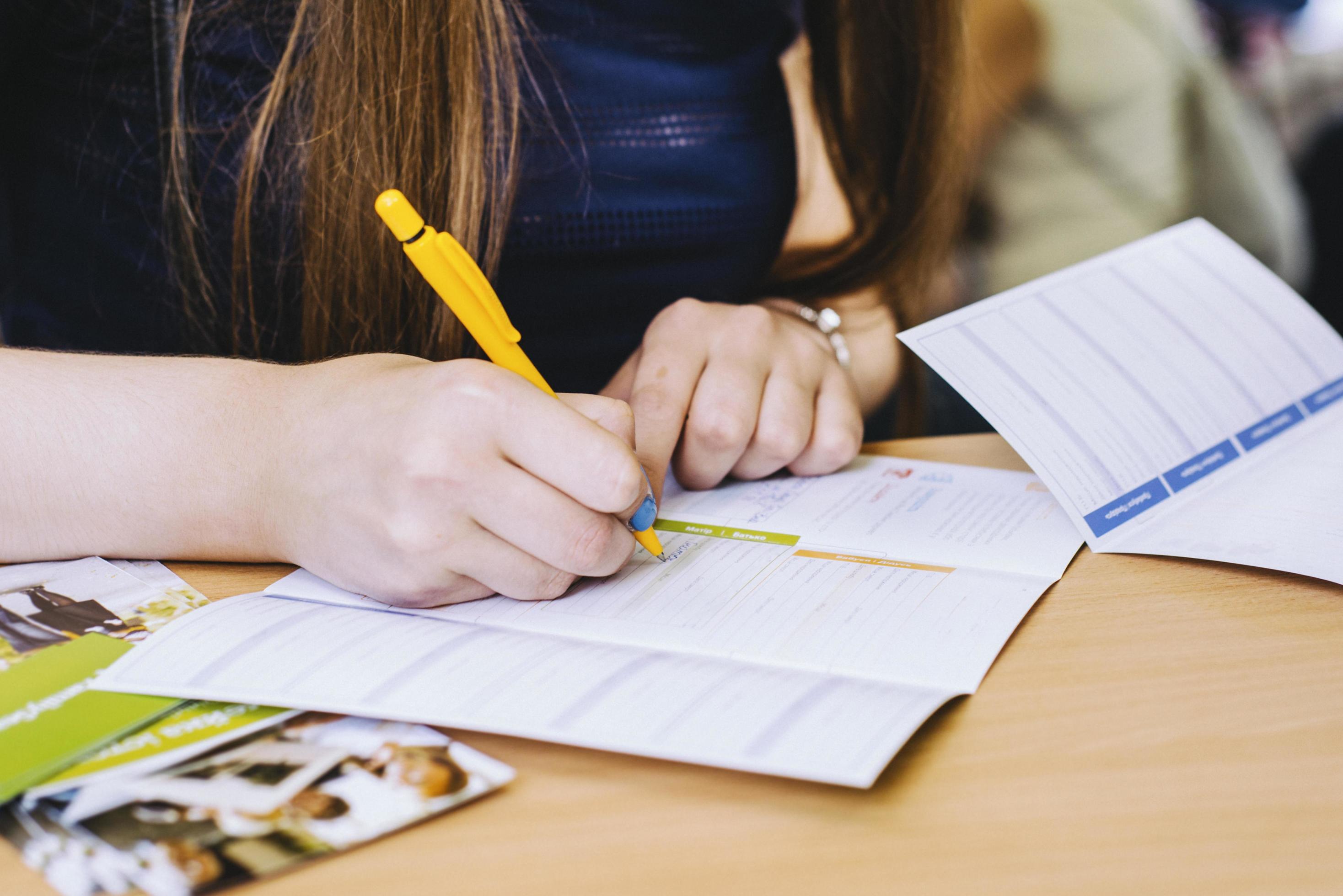 Woman writing in a planer 2245562 Stock Photo at Vecteezy