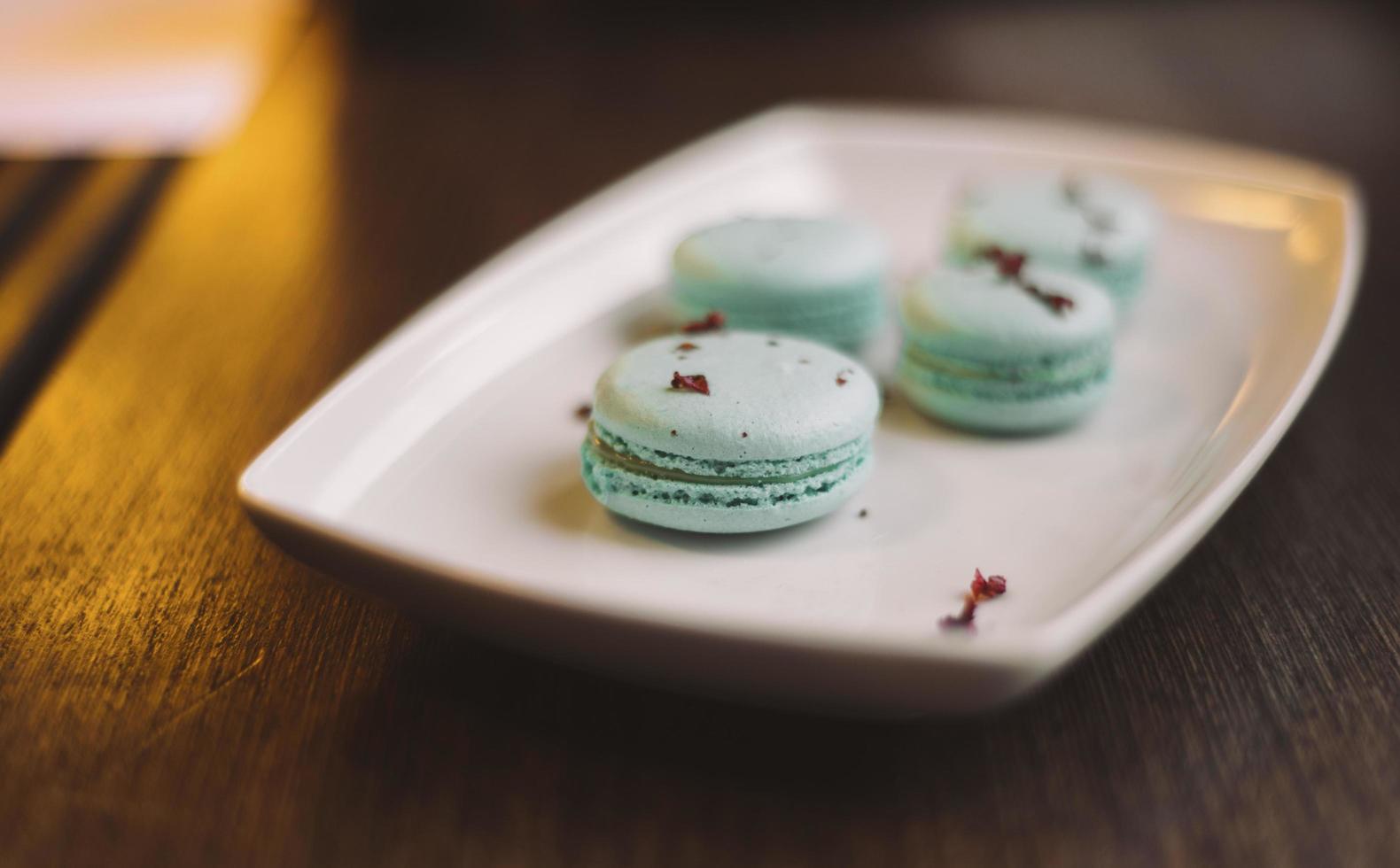 Blue macaroons on a plate photo