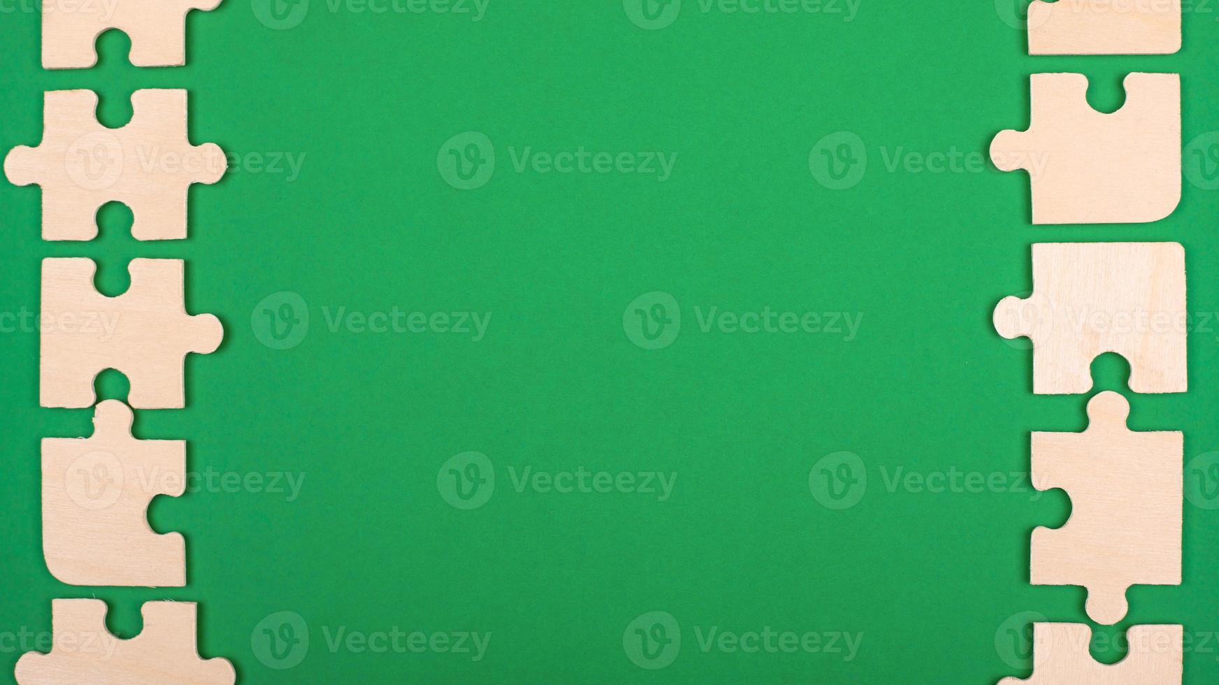 Green background with puzzles and copy space photo