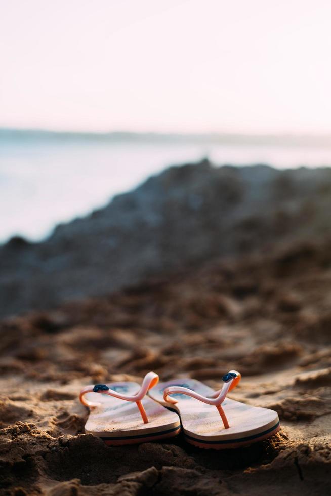 Flip-flops on the beach photo