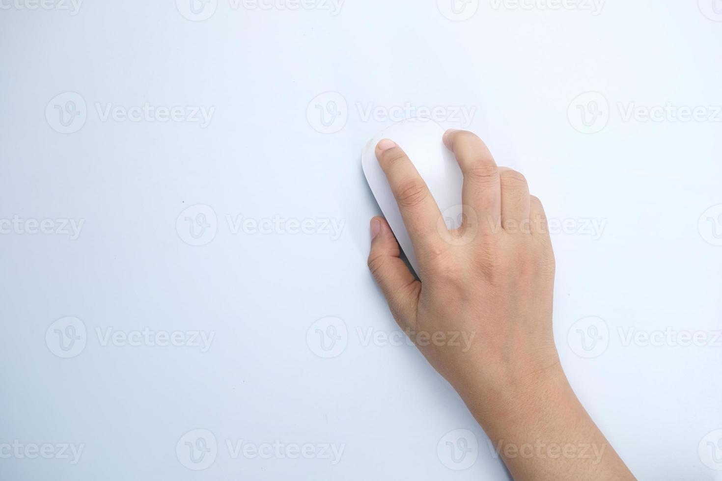 Hand with computer mouse on white background photo