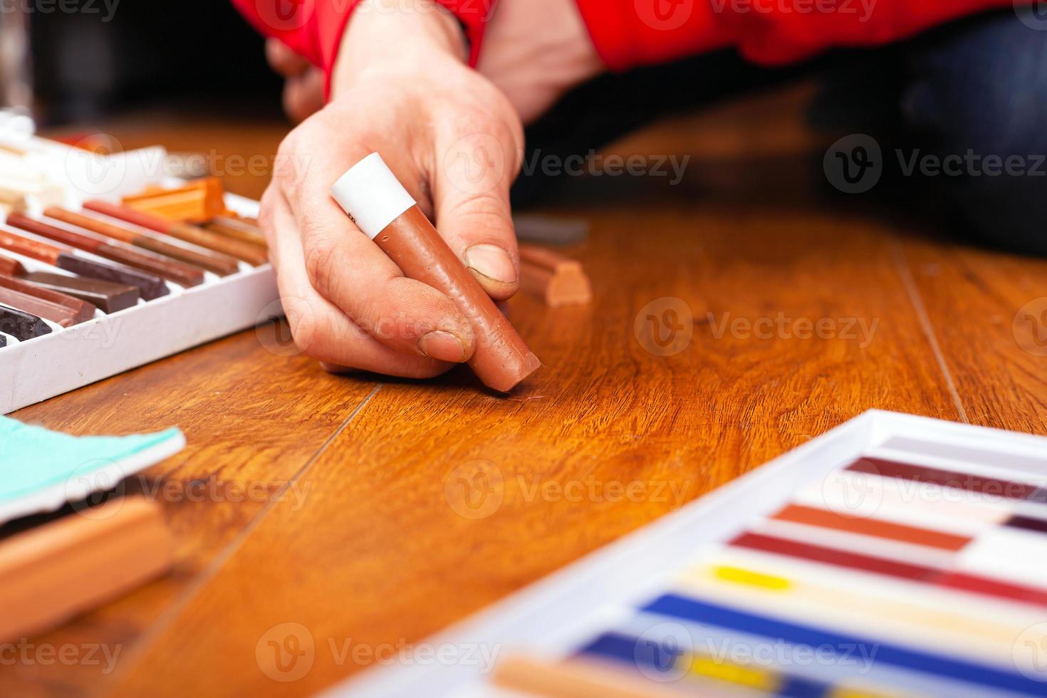 Delicate professional restoration of parquet, laminate with wax pencil photo
