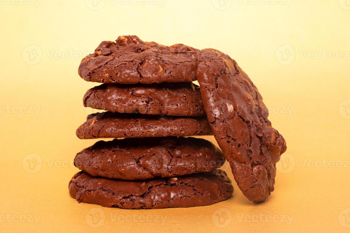 Glazed oatmeal cookies close-up on a yellow background photo