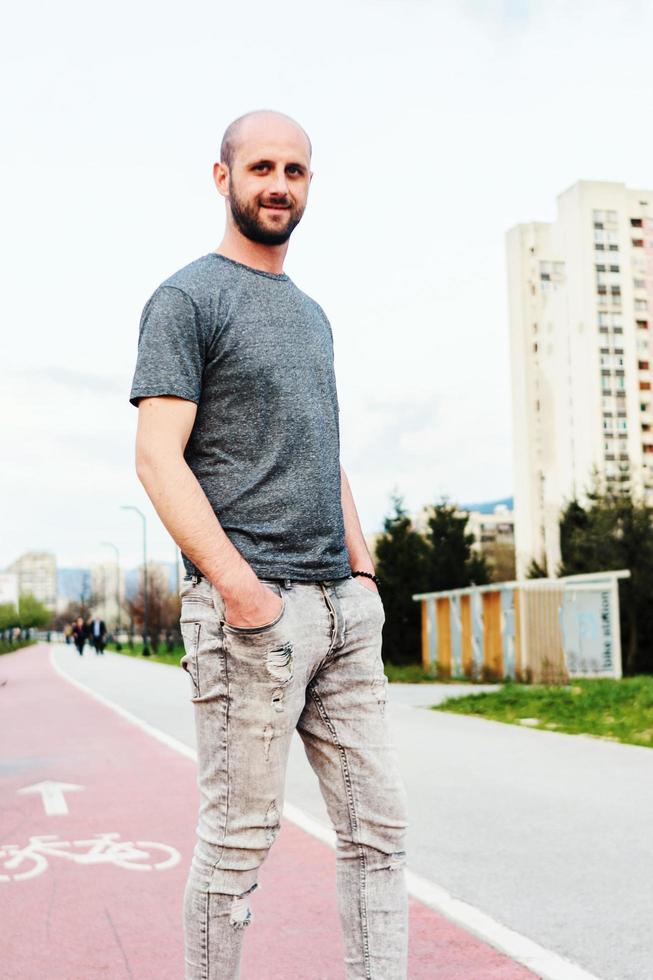 Portrait of young atractive man enjoying his day outside photo