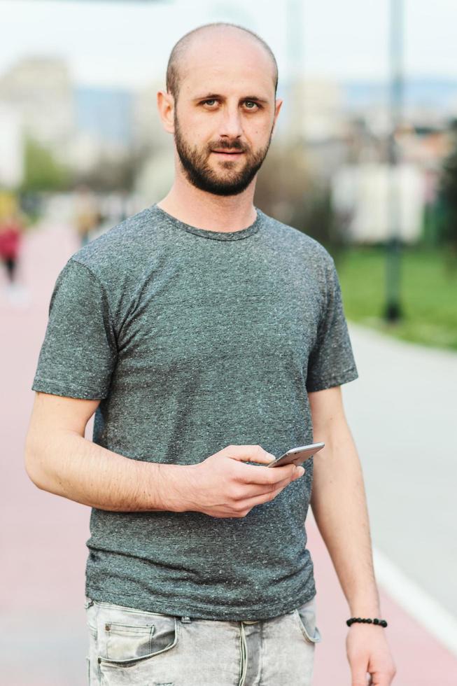 Portrait of young atractive man enjoying his day outside photo