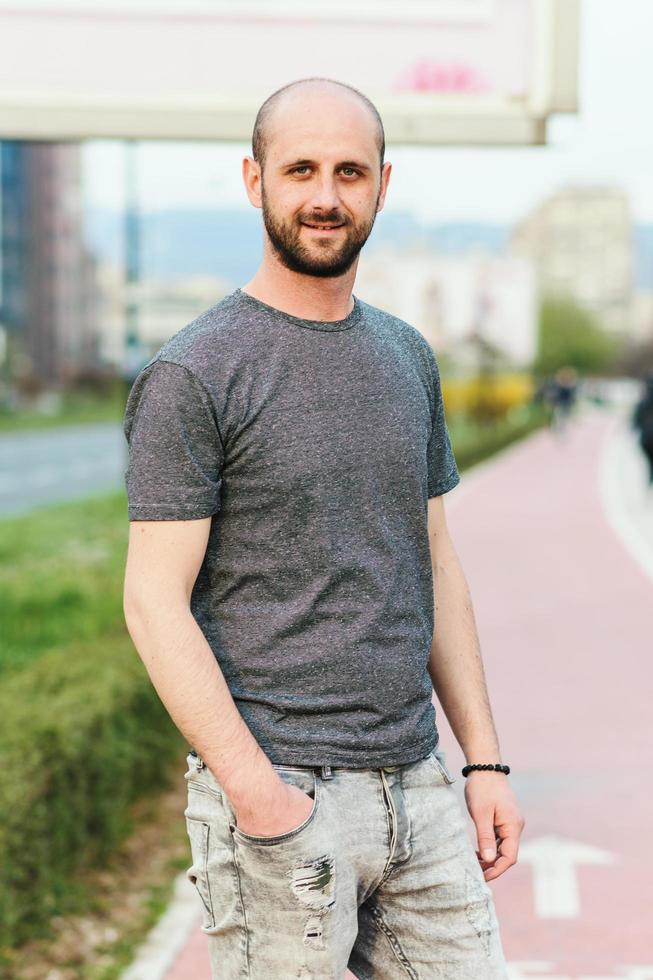 Portrait of young atractive man enjoying his day outside photo