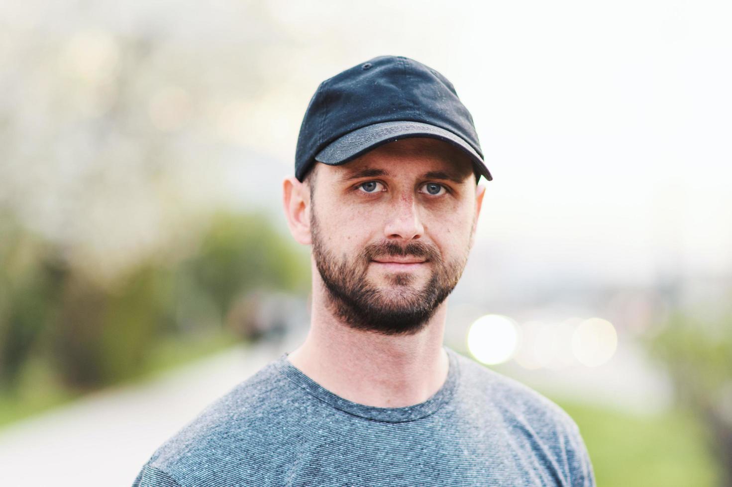 Portrait of young atractive man enjoying his day outside photo