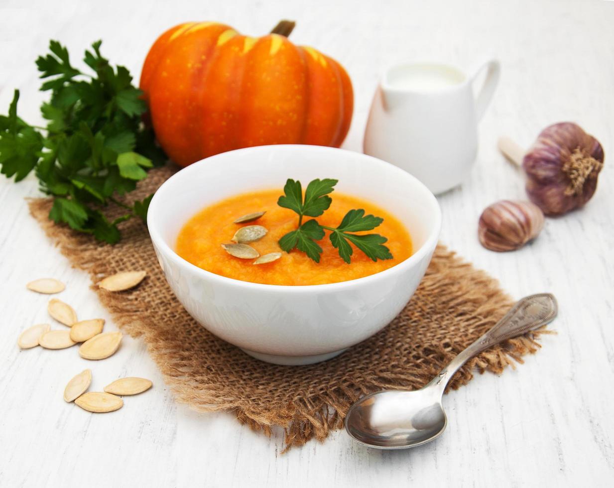 Pumpkin soup on a table photo