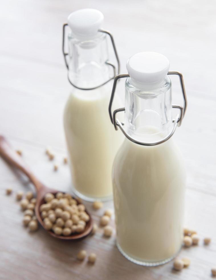 Soy milk and soy on the table photo