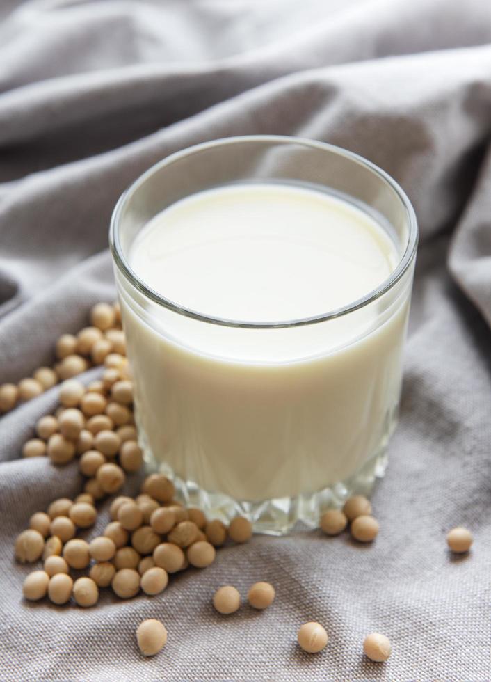 Soy milk and soy on the table photo