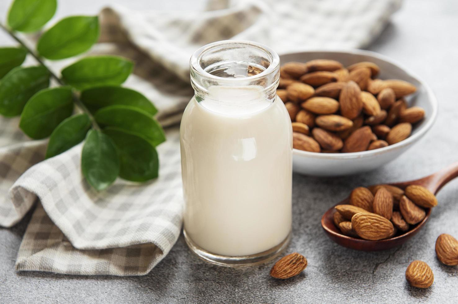 Almond milk and almonds photo