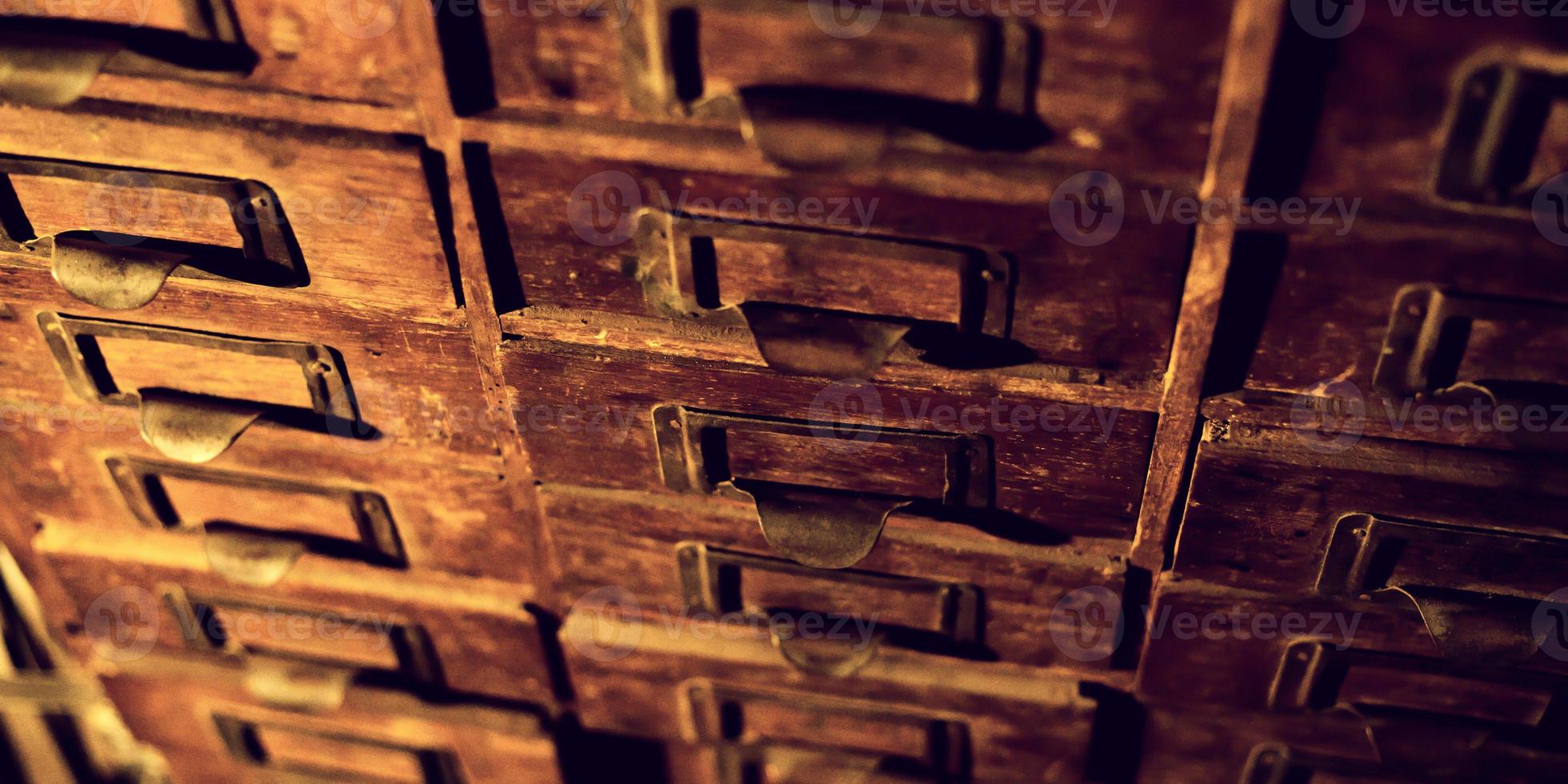 Old wooden wardrobe with small drawers photo