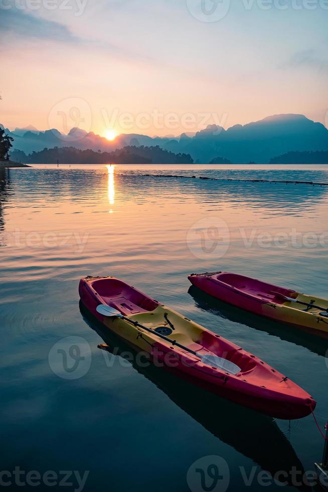 Paddle boat floating in a dam in southern Thailand in the morning photo