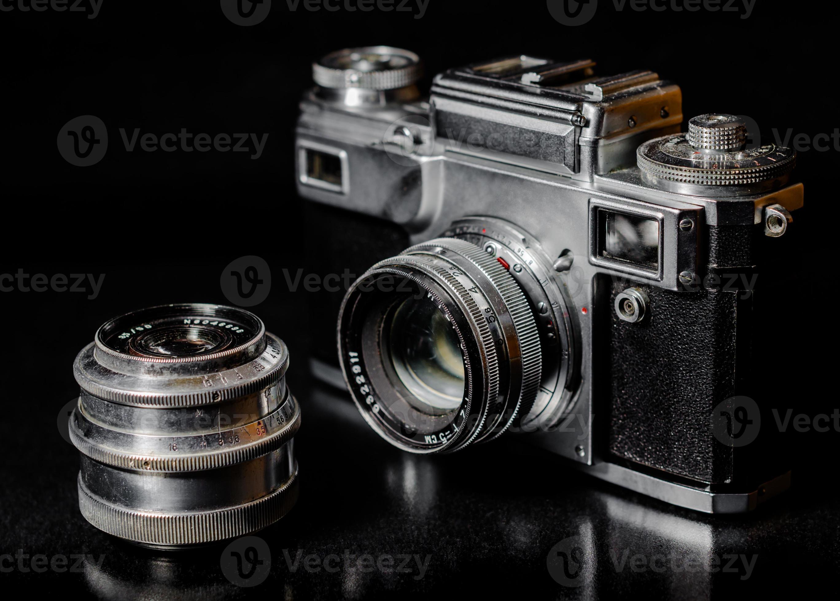 Vintage camera on a black background 2254037 Stock Photo at Vecteezy