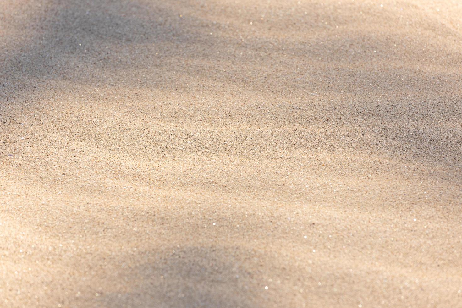 Rippled sand background texture with shadows photo