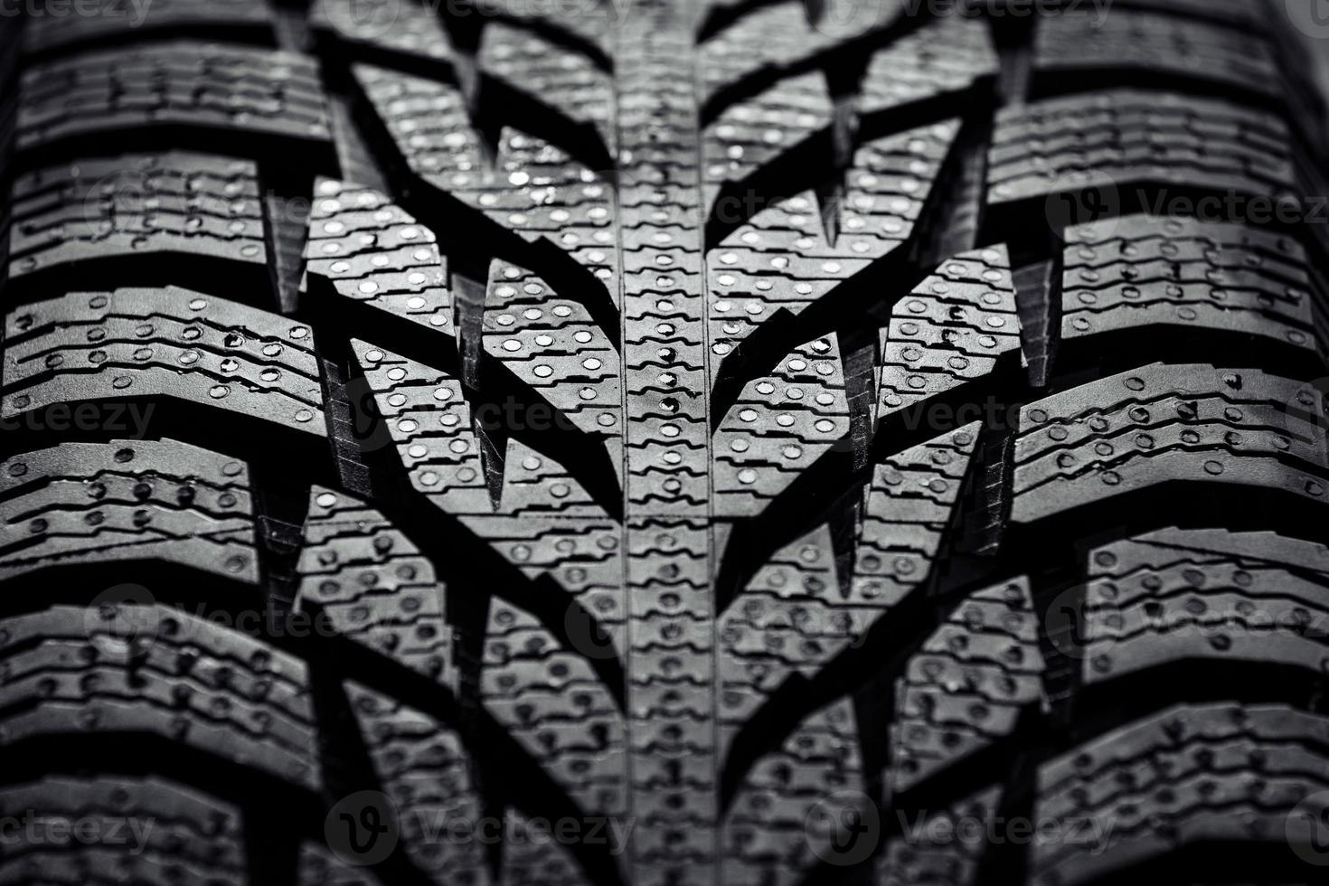 Close up of a new car tire, textured background photo