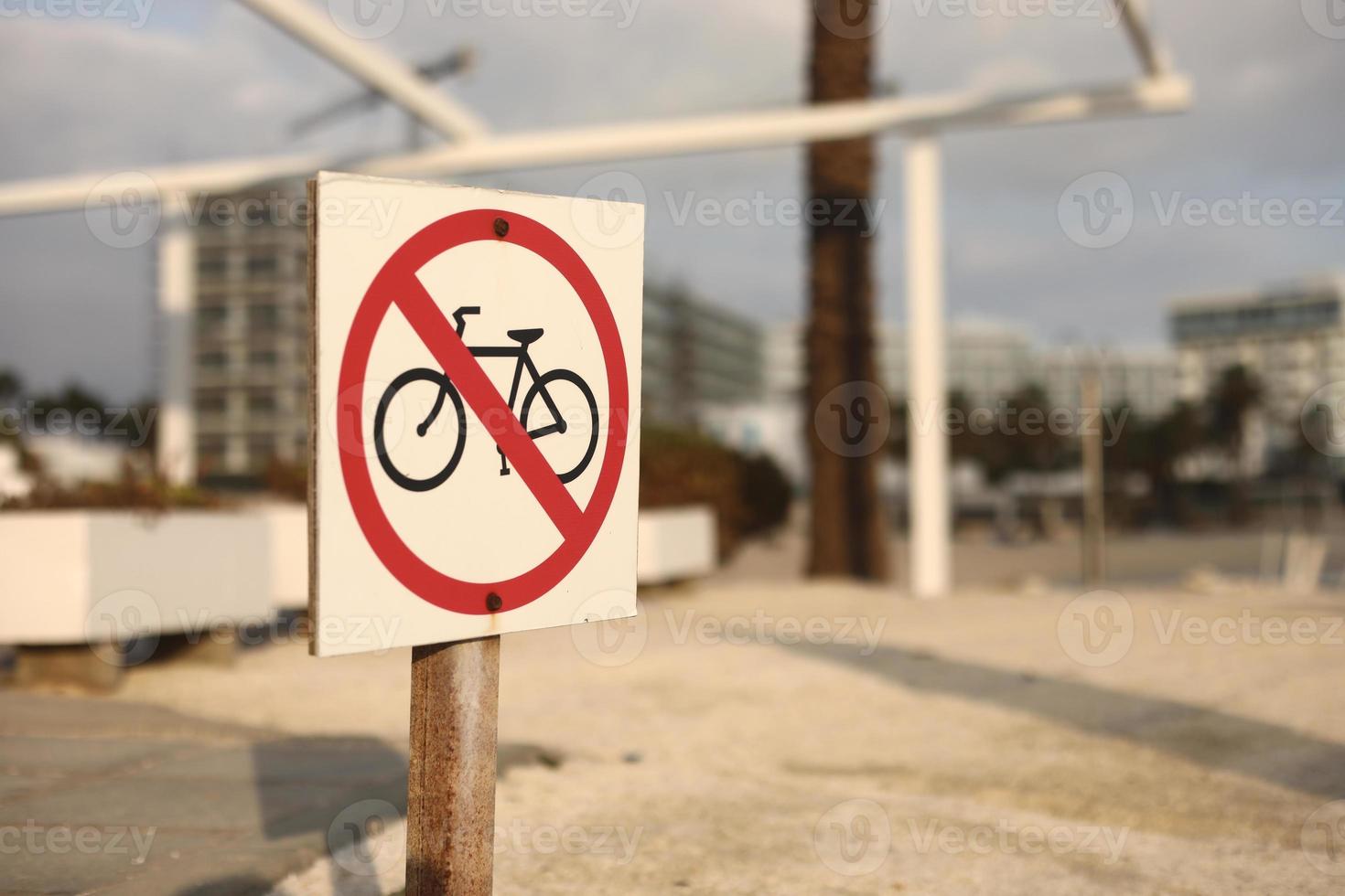 Beach traffic sign Do Not Enter with a bicycle. Selective focus, sign on the beach prohibiting bicycles. photo