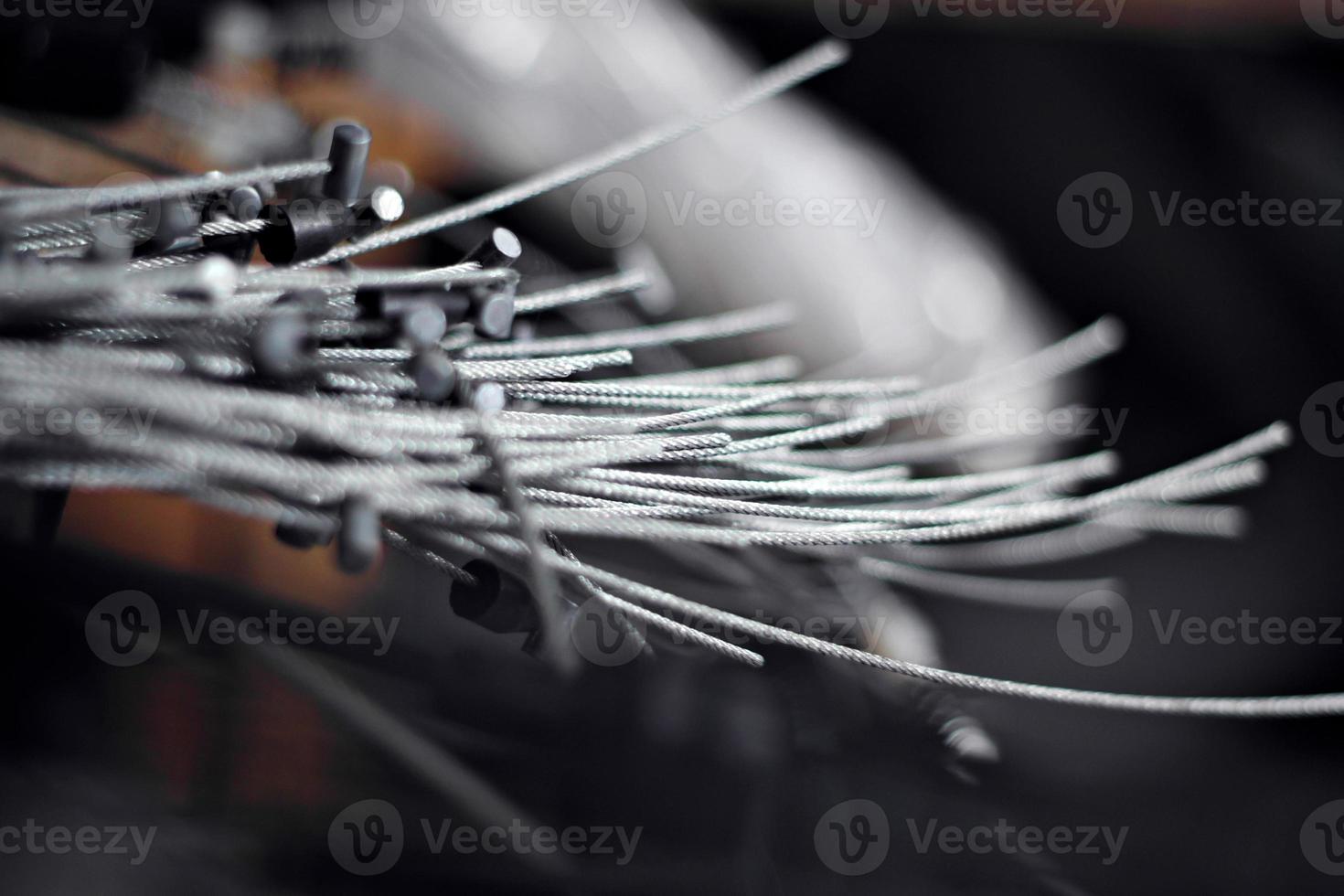 Pile of old metal brake cables, cable wires waiting for recycling photo