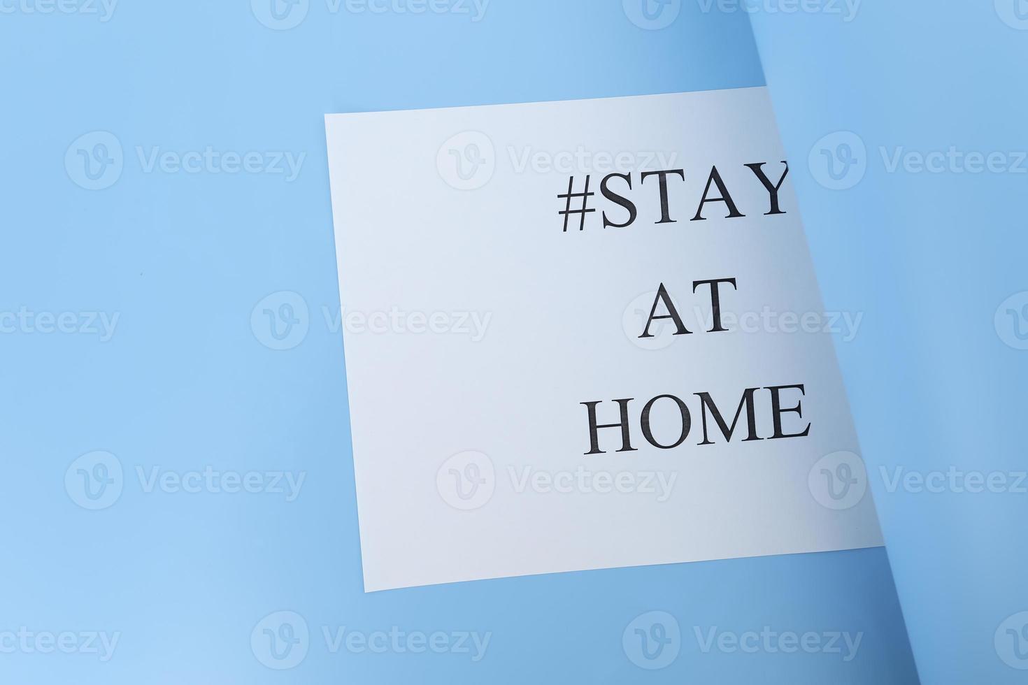 Stay at home concept. Paper with text, hashtag stay at home, isolated on white background. Coronavirus, COVID-19, self-quarantine, isolation. photo