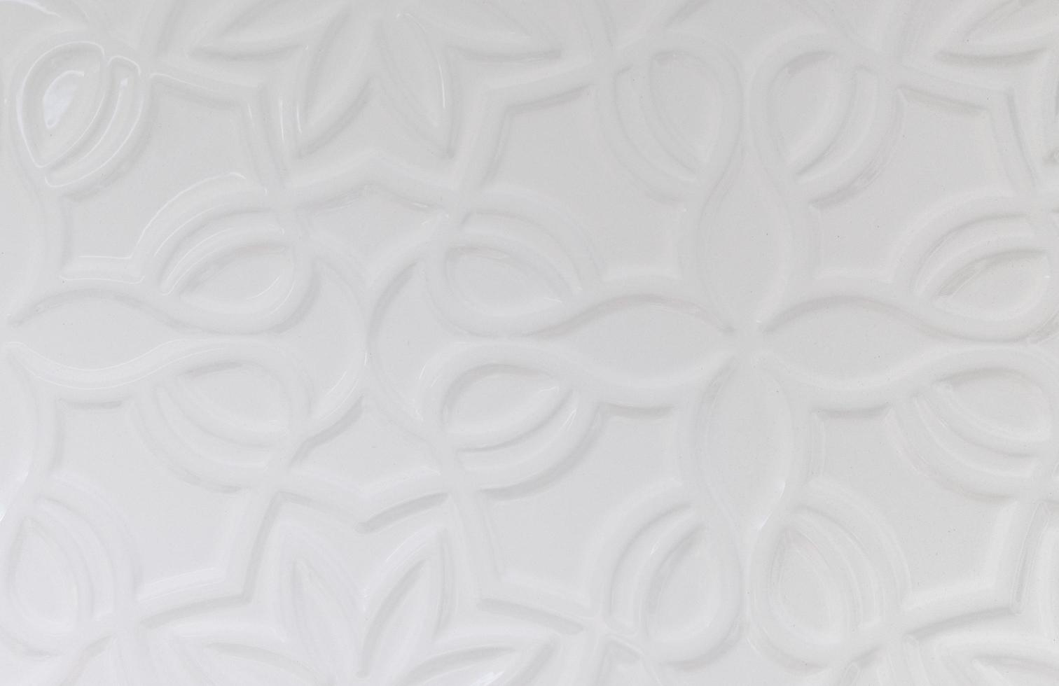 White wall background with various forms of ornamentation photo